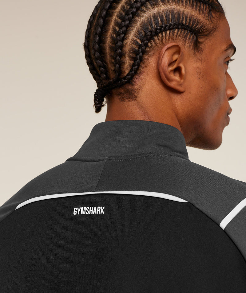 Gymshark Arrival Contrast 1/4 Zip Gris Negro - Detalle tela