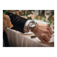 Reloj clásico de vestir Eco-Drive para hombre con pulsera de acero inoxidable y esfera marfil de Citizen, función día/fecha