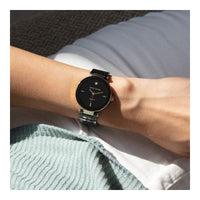 Reloj de pulsera Anne Klein para mujer con brazalete de cerámica negra y acento de diamante