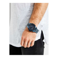 Reloj GUESS de acero inoxidable dorado con adornos de cristal, multifunción, resistente al agua, cierre desplegable