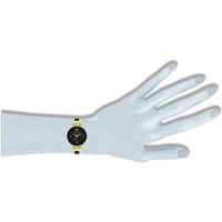 Reloj de pulsera Anne Klein con esfera de diamantes genuinos y diseño elegante en negro y dorado