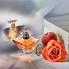 Lancôme Trésor Eau de Parfum con notas de rosa, lila, melocotón y flor de albaricoque, perfume elegante y romántico