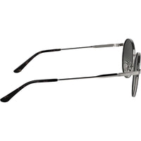 Lentes de sol Calvin Klein CK25101S con diseño redondo y marco de metal, incluyendo almohadillas nasales ajustables para mayor comodidad