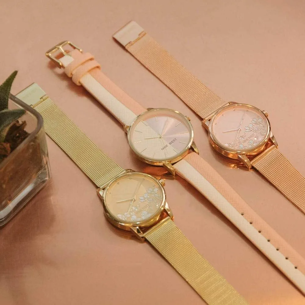 Reloj de pulsera para mujer Nine West en dorado con acero inoxidable, cristal resistente y diseño floral elegante